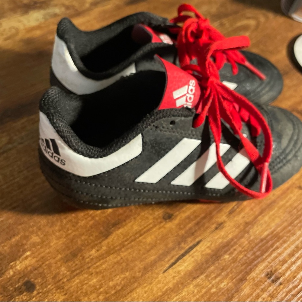 Adidas Black and Red cleats kids size 11